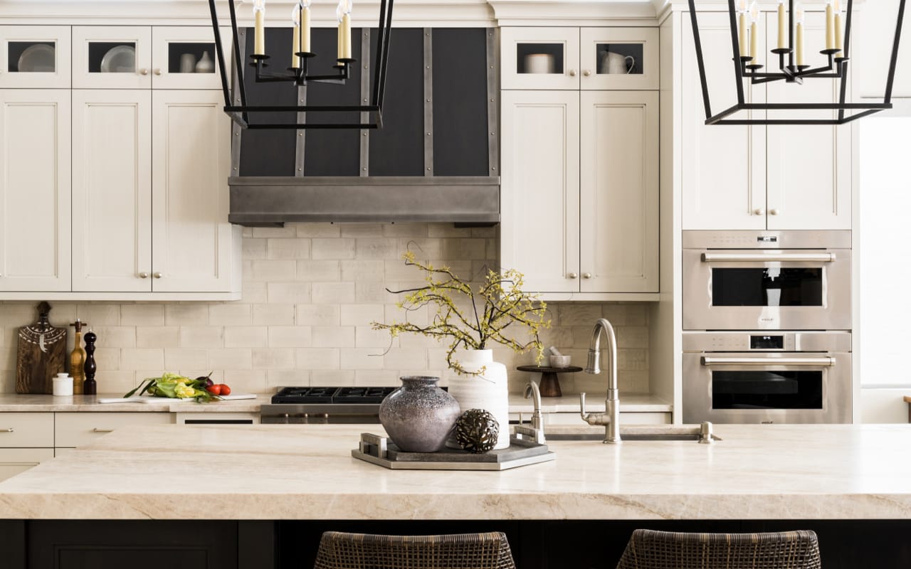 Transitional style kitchen with cream cabinety and grey accents.