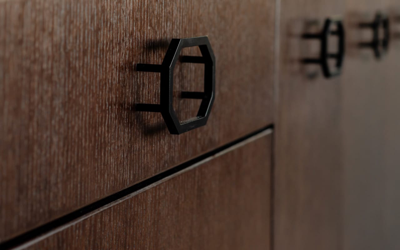 Detail of a kitchen island leg with ornate Traditional detailing.