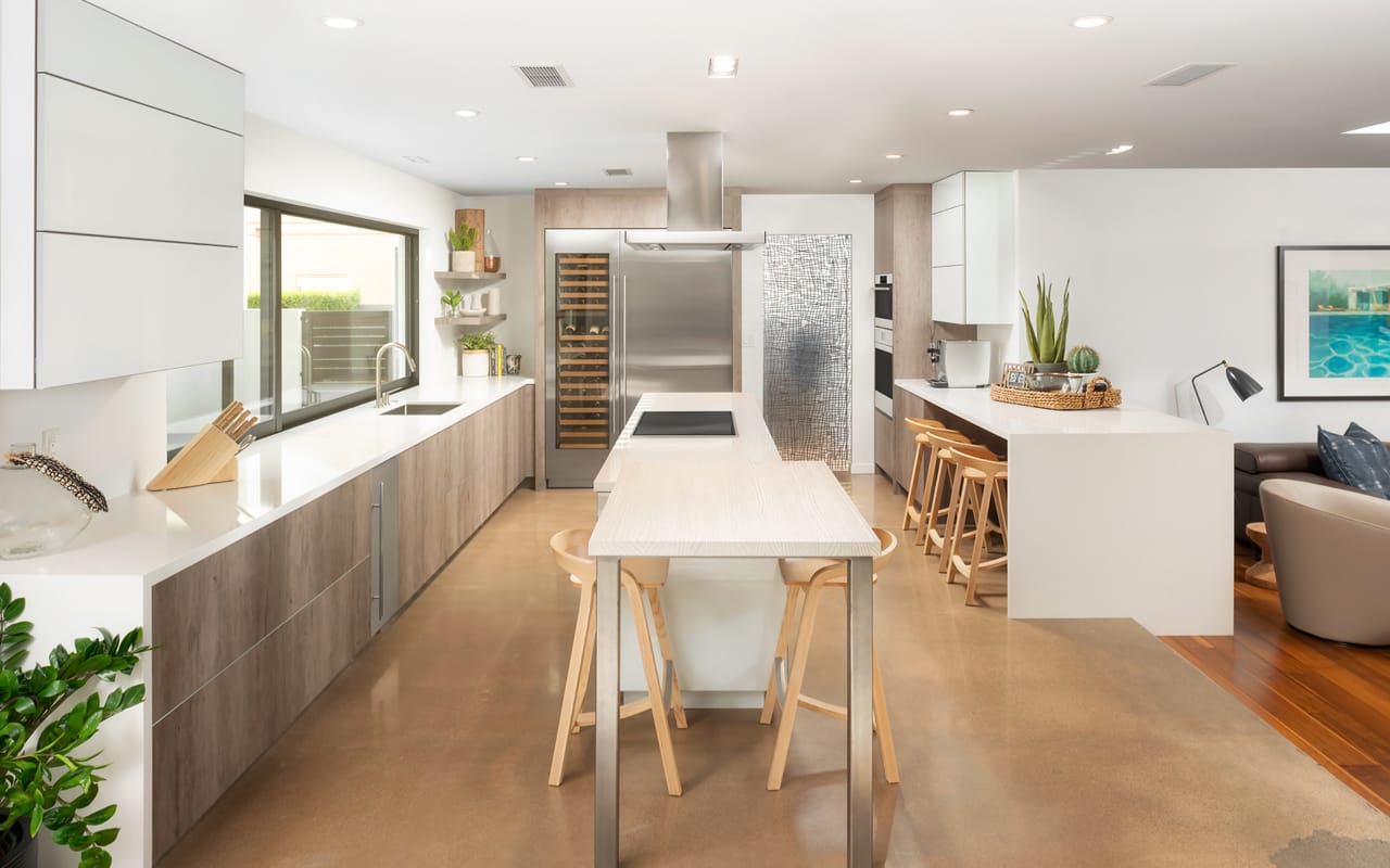 Modern contemporary kitchen with white and grey cabinetry and a center island.